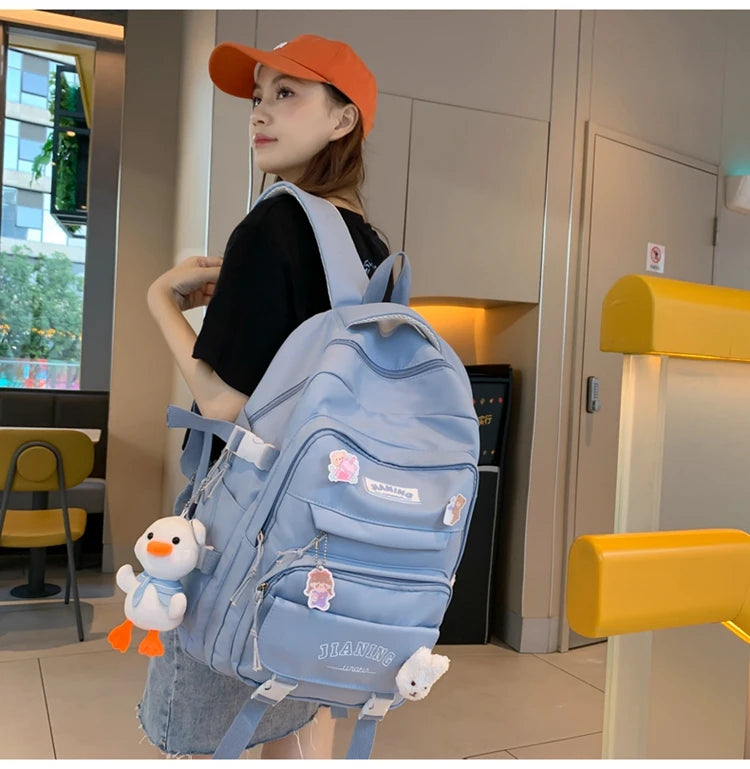 Cute Cartoon School Backpack for Girls Large Capacity with Plush Decorations Ideal for Daily Use