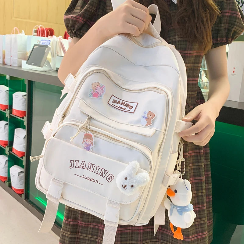 Cute Cartoon School Backpack for Girls Large Capacity with Plush Decorations Ideal for Daily Use