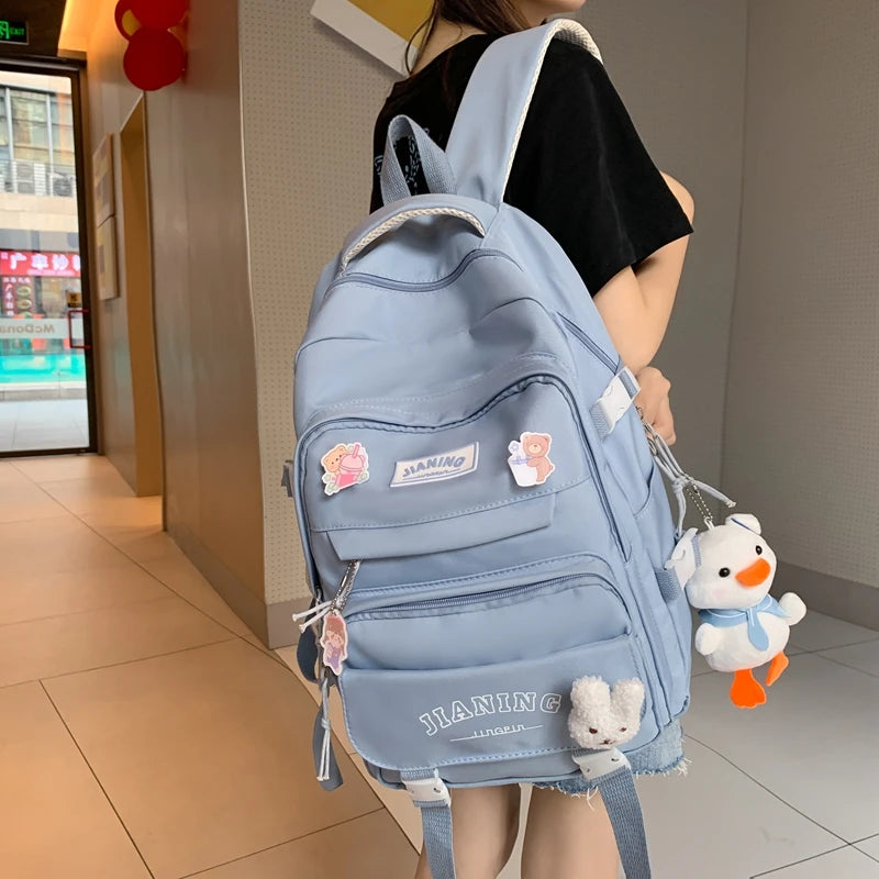Cute Cartoon School Backpack for Girls Large Capacity with Plush Decorations Ideal for Daily Use