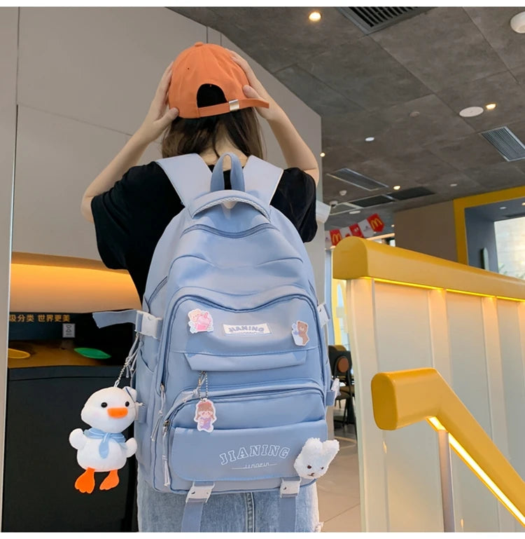 Cute Cartoon School Backpack for Girls Large Capacity with Plush Decorations Ideal for Daily Use