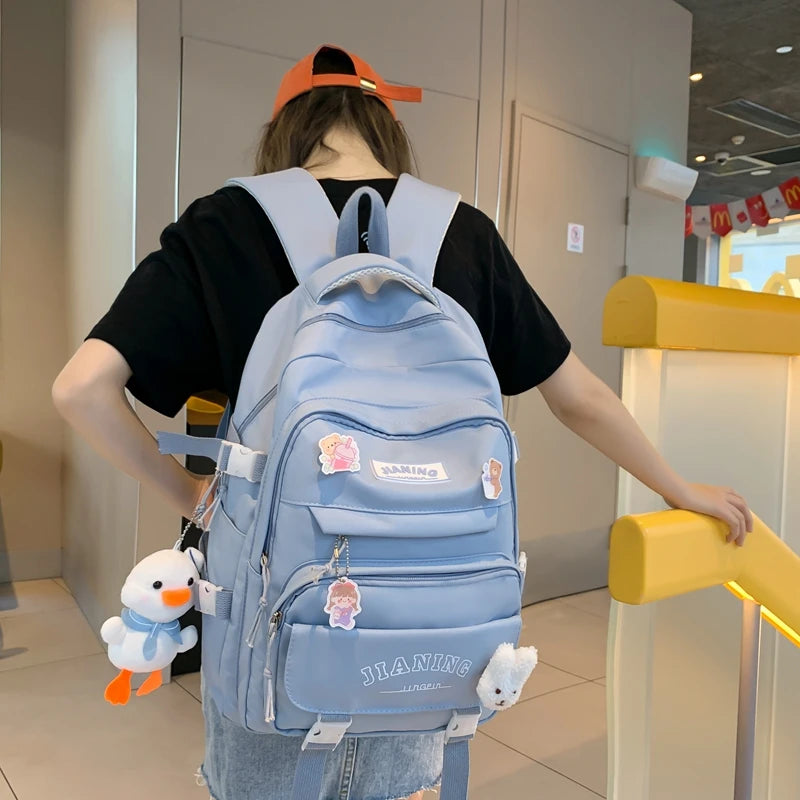 Cute Cartoon School Backpack for Girls Large Capacity with Plush Decorations Ideal for Daily Use