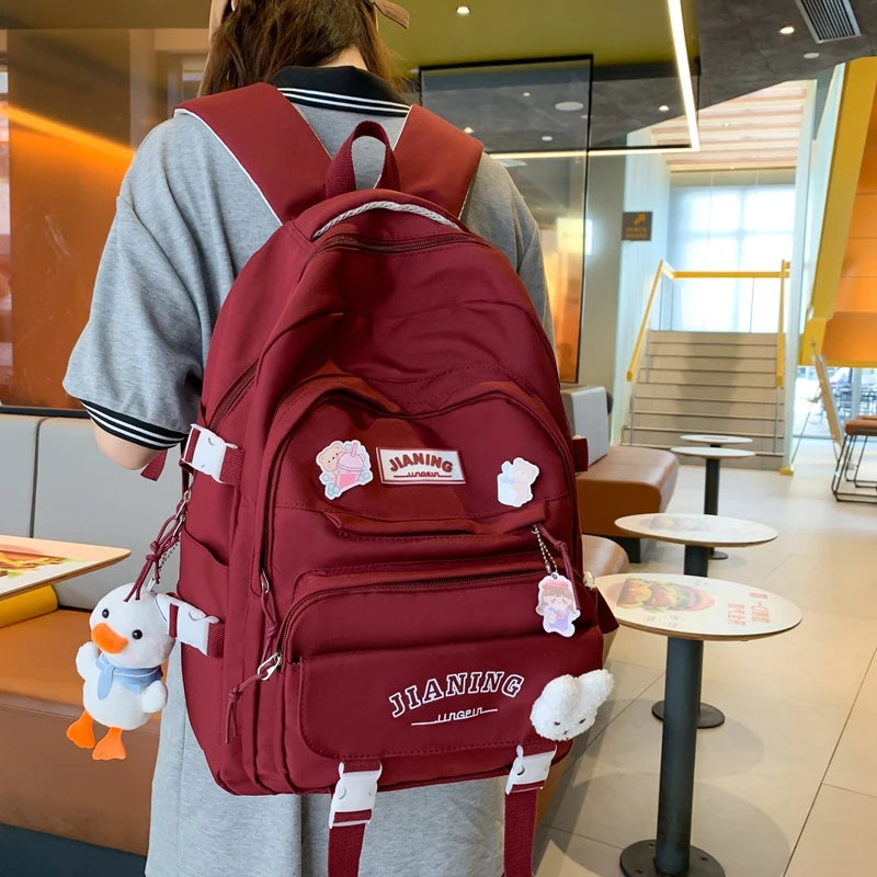 Cute Cartoon School Backpack for Girls Large Capacity with Plush Decorations Ideal for Daily Use