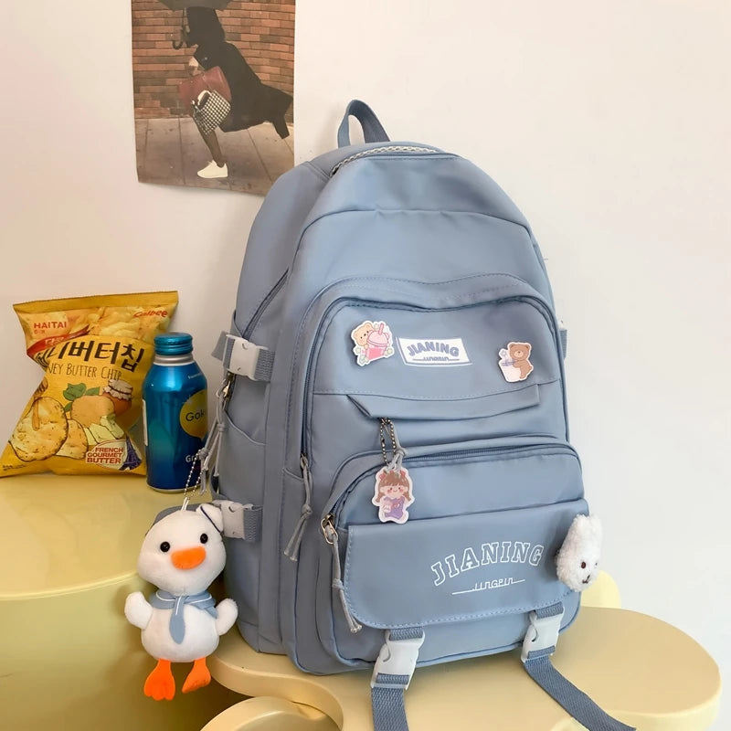 Cute Cartoon School Backpack for Girls Large Capacity with Plush Decorations Ideal for Daily Use